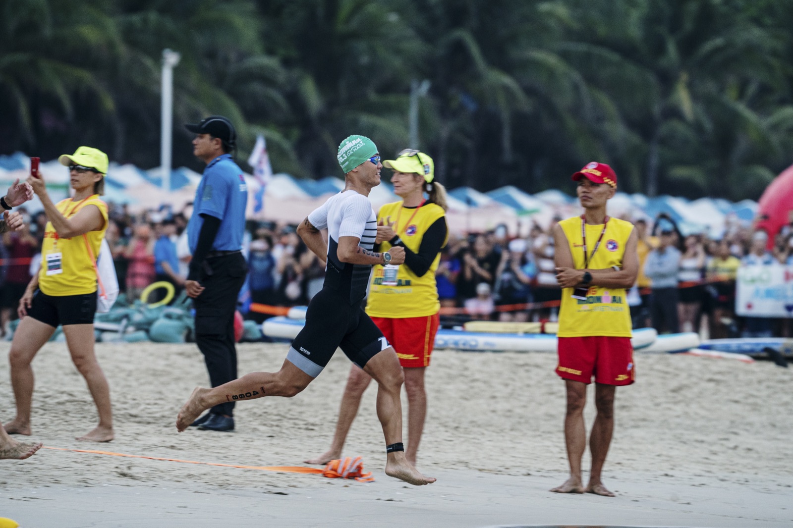 Onto the run leg with crowd cheering, IRONMAN 70.3 Vietnam Đà Nẵng