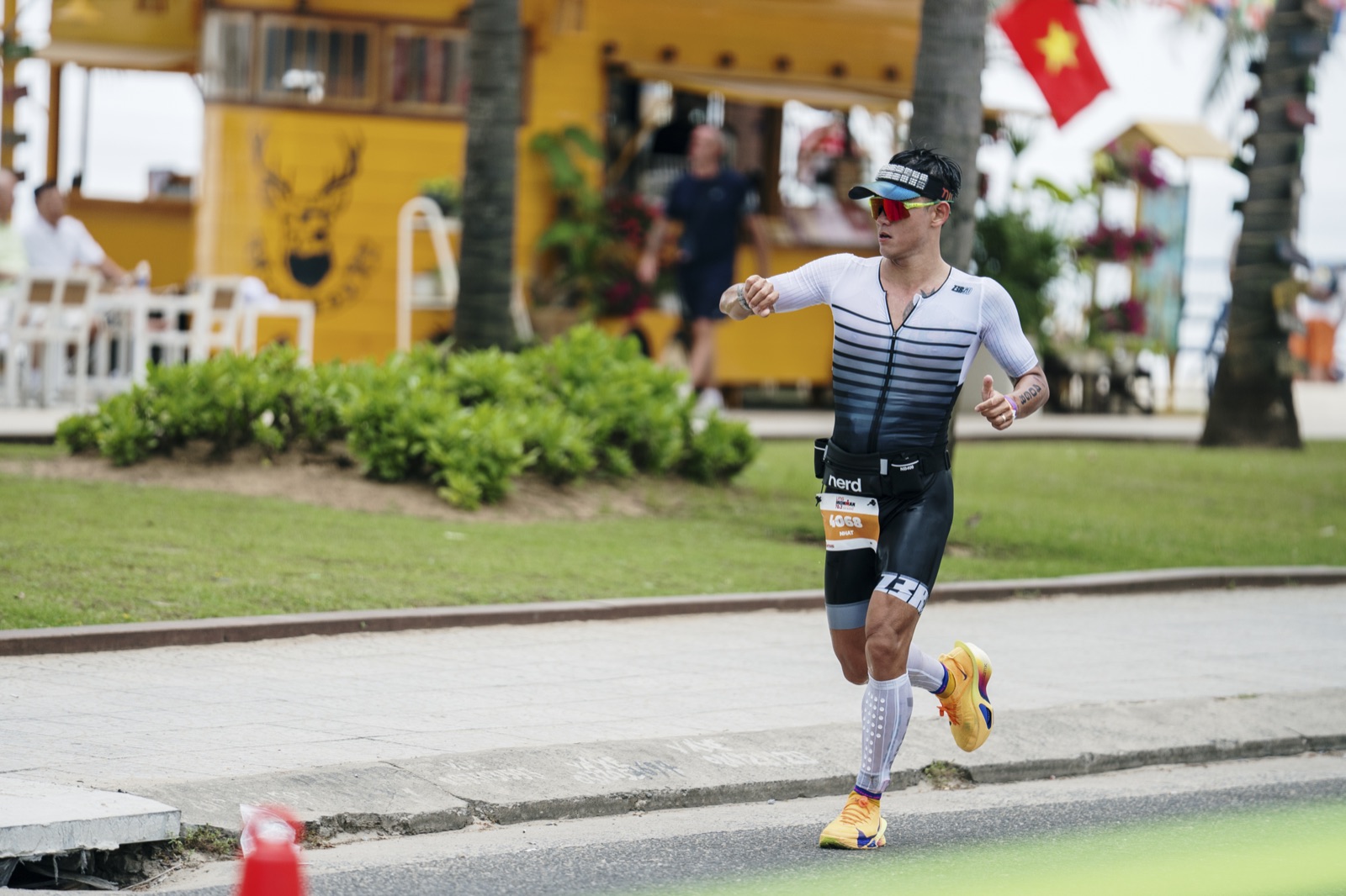 Mid-run with the Vietnamese flag in the background
